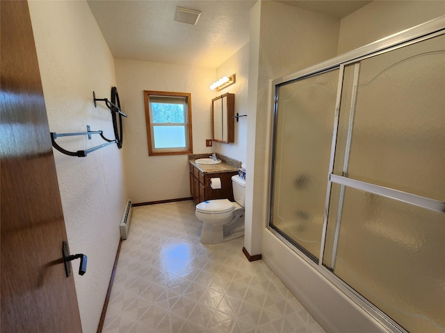 127 Patricia Way, Hamilton, MT 59840 - full bathroom with vanity, tile patterned floors, baseboard heating, and shower / bath combination with glass door