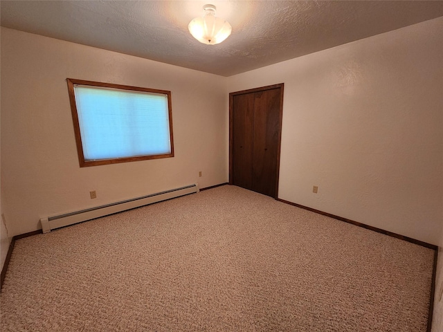 127 Patricia Way, Hamilton, MT 59840 - empty room featuring a baseboard radiator and light colored carpet