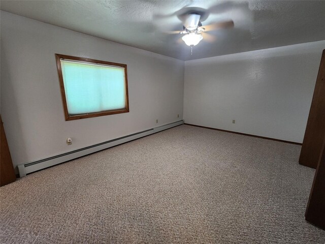 127 Patricia Way, Hamilton, MT 59840 - empty room featuring a baseboard heating unit, carpet flooring, and ceiling fan