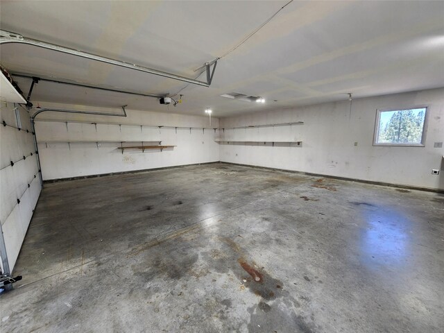 127 Patricia Way, Hamilton, MT 59840 - garage featuring a garage door opener