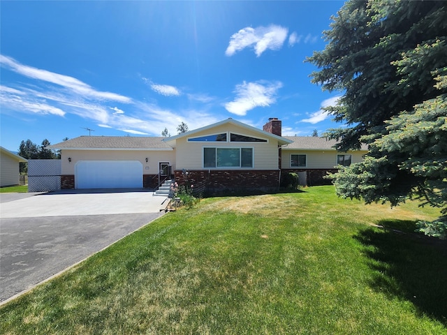 127 Patricia Way, Hamilton, MT 59840 - ranch-style home with a chimney, brick siding, asphalt driveway, an attached garage, and a front yard