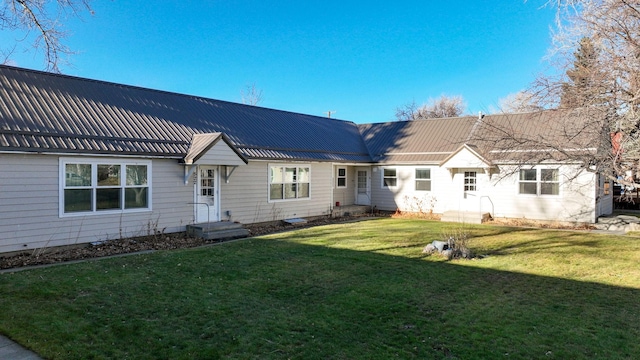 522 Main Ave N, Choteau, MT 59422 - rear view of property with a yard and a metal roof