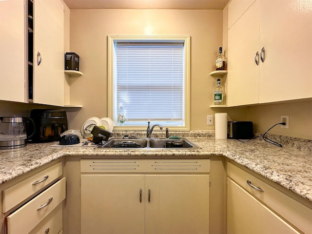 522 Main Ave N, Choteau, MT 59422 - kitchen with light countertops, white cabinetry, and open shelves