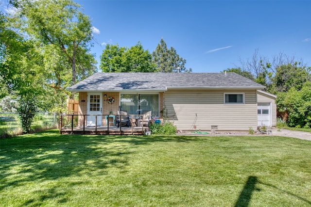 413 S 8th St, Hamilton, MT 59840 - back of property with an attached garage, a deck, brick siding, and driveway