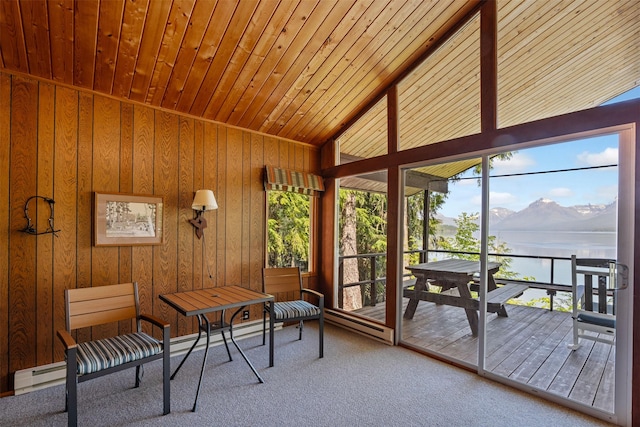 361 Grist Rd, West Glacier, MT 59936 - sunroom / solarium with a baseboard heating unit, vaulted ceiling, and a water and mountain view
