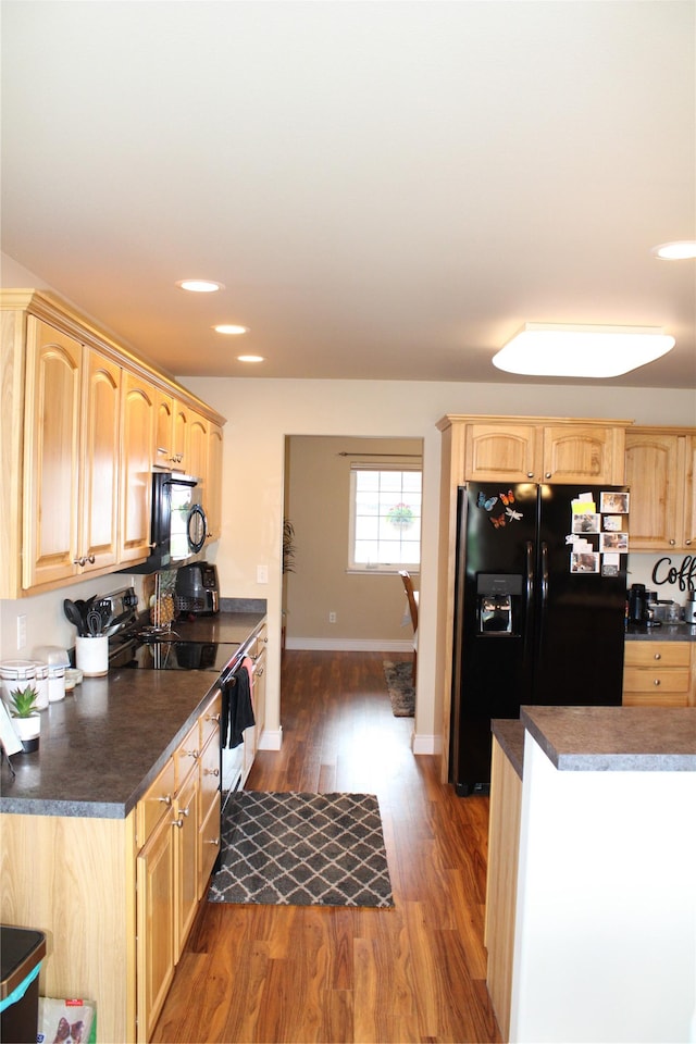 1230 Lucchese Rd, Helena, MT 59602 - kitchen featuring black appliances, light brown cabinetry, dark wood-style flooring, dark countertops, and recessed lighting