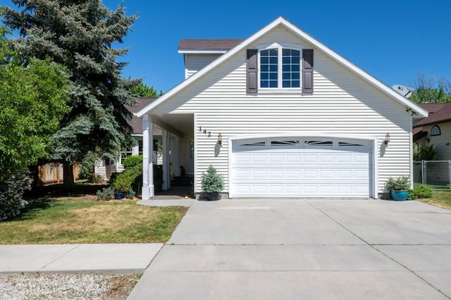 142 Thomas St, Hamilton, MT 59840 - traditional-style house with a garage and driveway