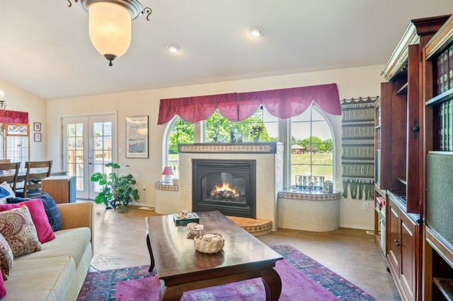 142 Thomas St, Hamilton, MT 59840 - living area with lofted ceiling, a glass covered fireplace, and french doors