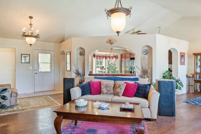142 Thomas St, Hamilton, MT 59840 - living room with vaulted ceiling, arched walkways, plenty of natural light, and wood finished floors