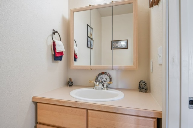 142 Thomas St, Hamilton, MT 59840 - bathroom featuring vanity and a textured wall
