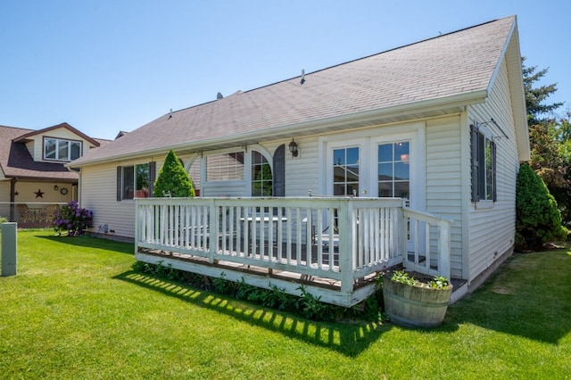142 Thomas St, Hamilton, MT 59840 - rear view of property with a deck, a yard, and roof with shingles