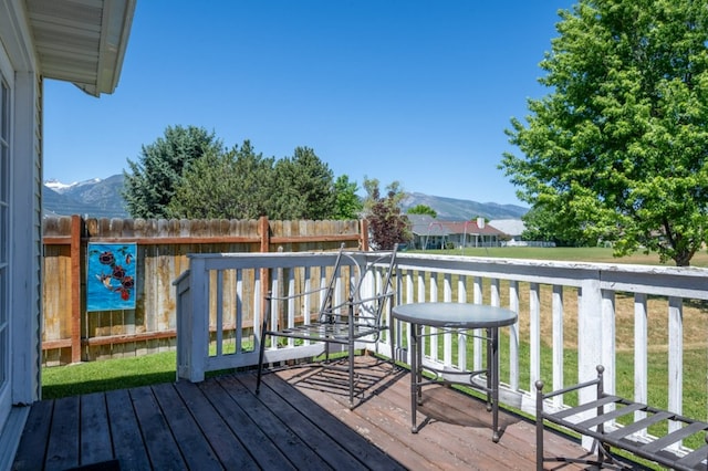 142 Thomas St, Hamilton, MT 59840 - wooden terrace with a mountain view and a yard