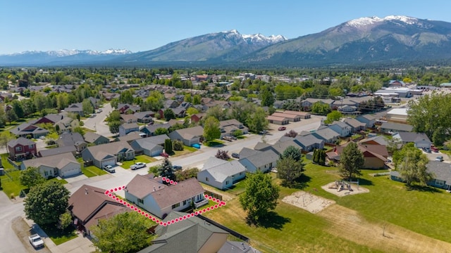 142 Thomas St, Hamilton, MT 59840 - aerial perspective of suburban area featuring a mountainous background and property boundaries highlighted