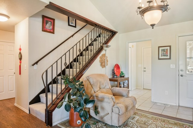 142 Thomas St, Hamilton, MT 59840 - entryway featuring stairway, a chandelier, and tile patterned floors