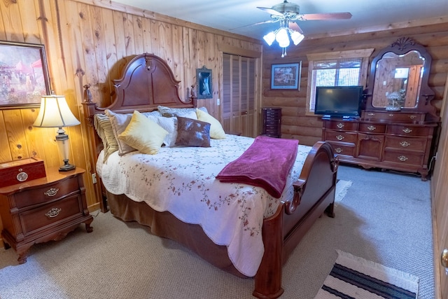347 Upper Ross Gulch Rd, Townsend, MT 59644 - bedroom featuring light colored carpet, a ceiling fan, rustic walls, wood walls, and a closet