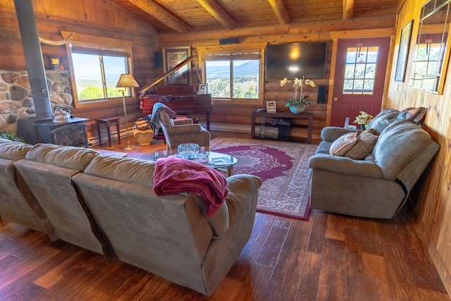 347 Upper Ross Gulch Rd, Townsend, MT 59644 - living room with a wood stove, hardwood / wood-style flooring, log walls, and a wood ceiling with exposed beams