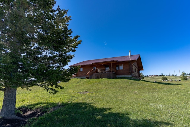 347 Upper Ross Gulch Rd, Townsend, MT 59644 - back of house with log siding, a yard, and a metal roof