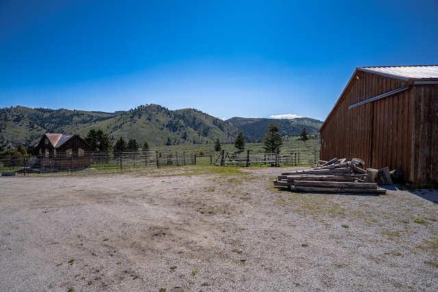 347 Upper Ross Gulch Rd, Townsend, MT 59644 - view of yard with a mountain view, an outbuilding, and a rural view