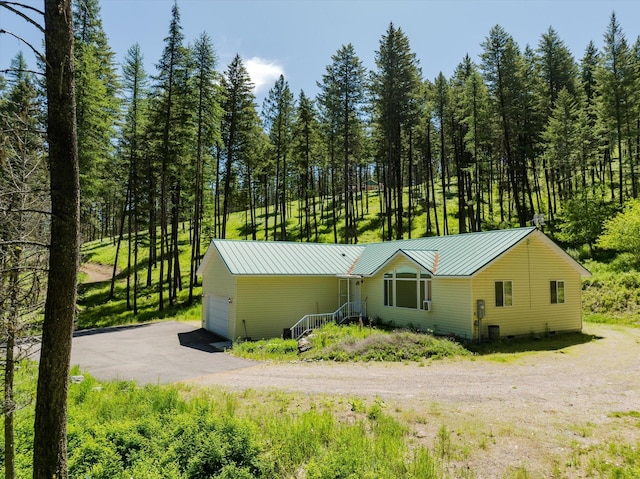42843 Jette Lake Trl, Polson, MT 59860 - view of front facade with a garage and metal roof