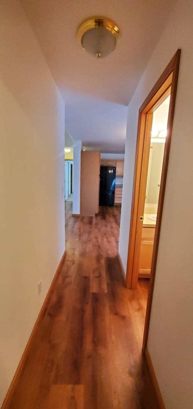 42843 Jette Lake Trl, Polson, MT 59860 - hallway with wood finished floors and baseboards