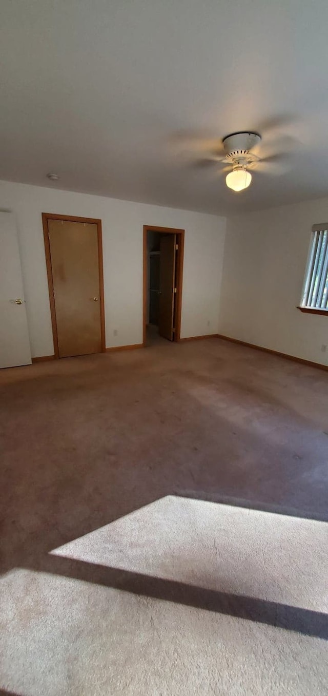 42843 Jette Lake Trl, Polson, MT 59860 - carpeted empty room featuring baseboards and ceiling fan