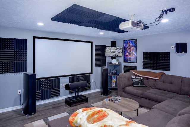 220 W Cedar St, Libby, MT 59923 - home theater featuring wood finished floors, baseboards, recessed lighting, and a textured ceiling