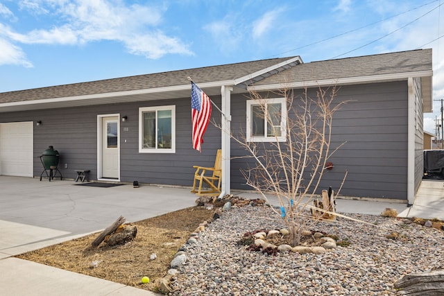 108 Timmons St, Dillon, MT 59725 - view of front of house with concrete driveway and a garage