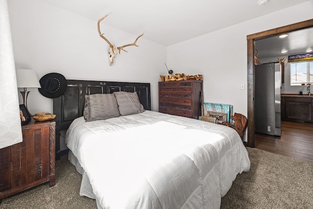 108 Timmons St, Dillon, MT 59725 - bedroom featuring freestanding refrigerator and carpet flooring