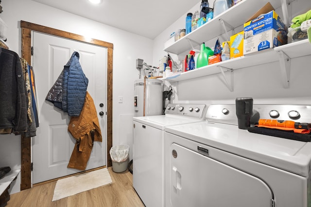 108 Timmons St, Dillon, MT 59725 - laundry room featuring washing machine and clothes dryer, light wood-type flooring, and secured water heater