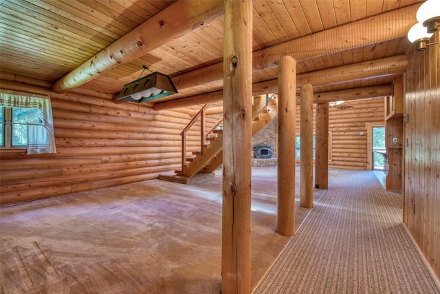 1795 E Fork Rd, Sula, MT 59871 - hallway with log walls, wooden ceiling with exposed beams, stairs, and carpet flooring