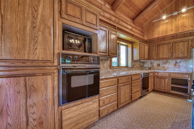 1795 E Fork Rd, Sula, MT 59871 - kitchen featuring black appliances, light countertops, brown cabinetry, rustic walls, and wood ceiling
