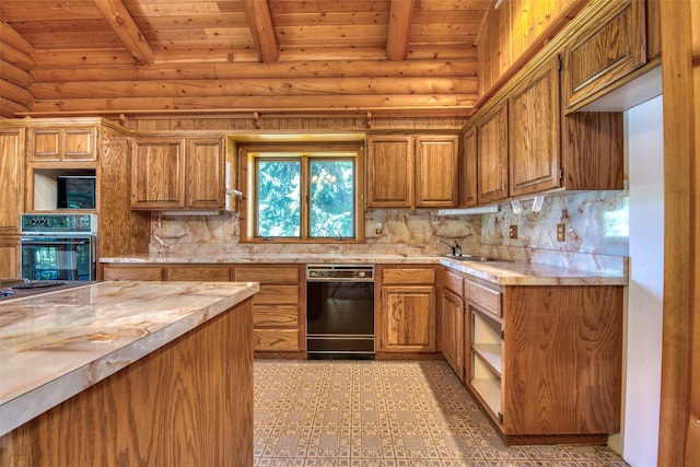 1795 E Fork Rd, Sula, MT 59871 - kitchen featuring black appliances, rustic walls, wood ceiling with exposed beams, light countertops, and brown cabinets
