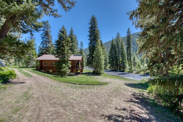 1795 E Fork Rd, Sula, MT 59871 - view of dirt / gravel driveway with a forest view