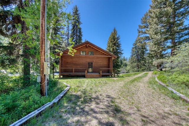 1795 E Fork Rd, Sula, MT 59871 - view of side of property with log siding and a deck