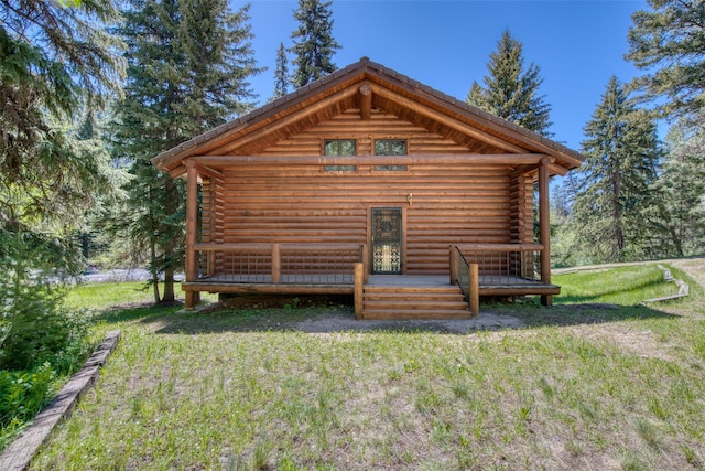 1795 E Fork Rd, Sula, MT 59871 - rear view of property with a lawn, a deck, and log siding