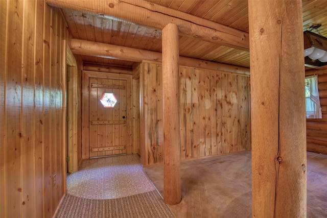 1795 E Fork Rd, Sula, MT 59871 - entryway with wood ceiling with exposed beams, carpet flooring, wood walls, and rustic walls