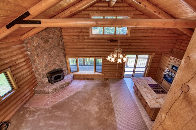 1795 E Fork Rd, Sula, MT 59871 - unfurnished living room with wood ceiling with exposed beams, a chandelier, high vaulted ceiling, plenty of natural light, and rustic walls