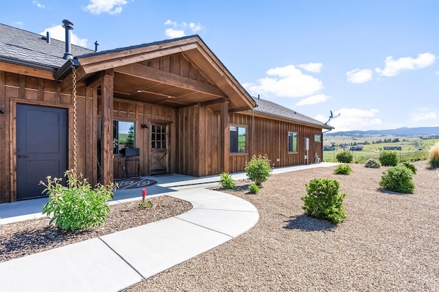 144 Prickly Pear Ct, Florence, MT 59833 - property entrance featuring board and batten siding and a mountain view