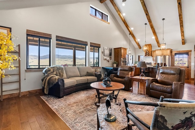 144 Prickly Pear Ct, Florence, MT 59833 - living area with high vaulted ceiling, beam ceiling, wood-type flooring, recessed lighting, and a mountain view