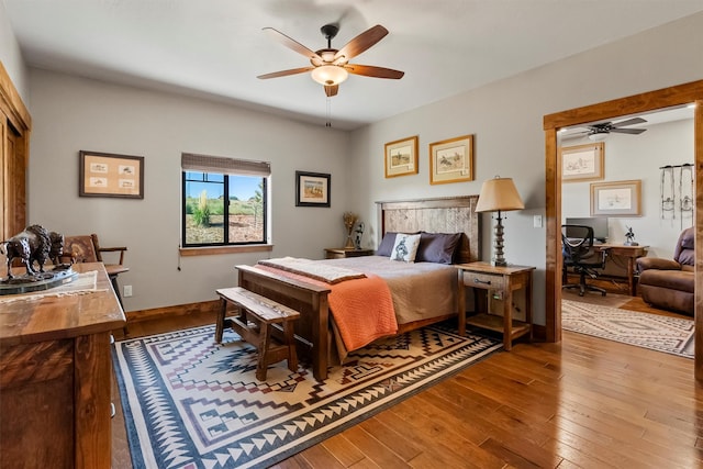 144 Prickly Pear Ct, Florence, MT 59833 - bedroom featuring an office area, hardwood / wood-style floors, and ceiling fan