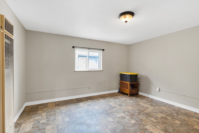245 Marcus St, Hamilton, MT 59840 - unfurnished bedroom with stone finish floors and a heating unit