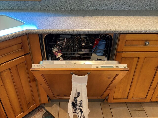 50-60 Willow Bend Ln, Cascade, MT 59421 - kitchen view of brown cabinetry, light countertops, a sink, and dishwasher