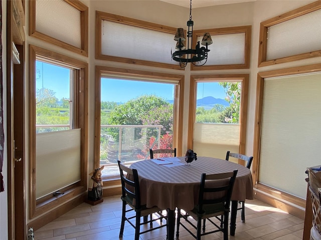 50-60 Willow Bend Ln, Cascade, MT 59421 - dining room featuring light wood-type flooring, a chandelier, and healthy amount of natural light