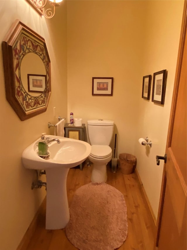 50-60 Willow Bend Ln, Cascade, MT 59421 - half bathroom featuring wood finished floors, toilet, and baseboards