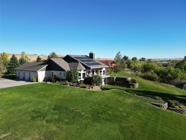 50-60 Willow Bend Ln, Cascade, MT 59421 - view of front of house with solar panels, a front lawn, and a chimney