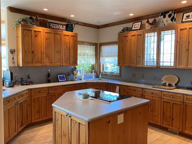 50-60 Willow Bend Ln, Cascade, MT 59421 - kitchen with black electric stovetop, backsplash, light countertops, a kitchen island, and recessed lighting
