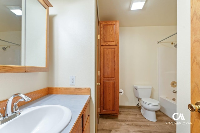 3036 Mchugh Ln, Helena, MT 59601 - full bath featuring vanity, wood finished floors, and bathing tub / shower combination
