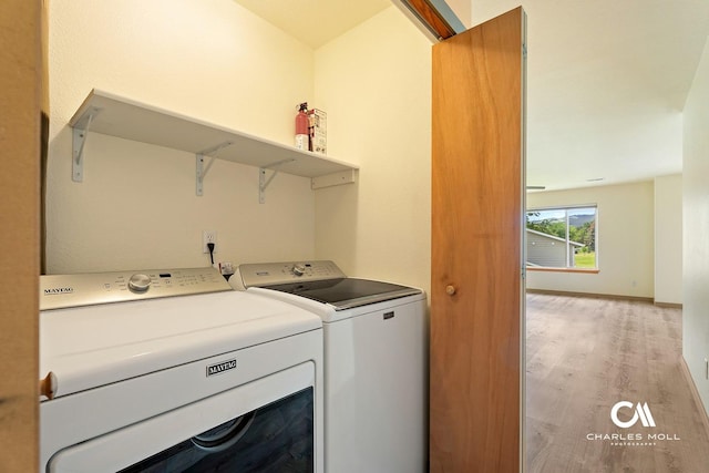 3036 Mchugh Ln, Helena, MT 59601 - washroom featuring separate washer and dryer and light wood-style flooring