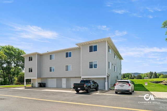 3036 Mchugh Ln, Helena, MT 59601 - view of side of home featuring a mountain view, a garage, and driveway