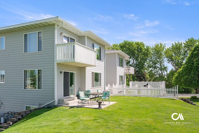 3036 Mchugh Ln, Helena, MT 59601 - back of property with a balcony, entry steps, and a patio